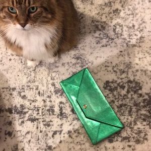 Metallic green clutch